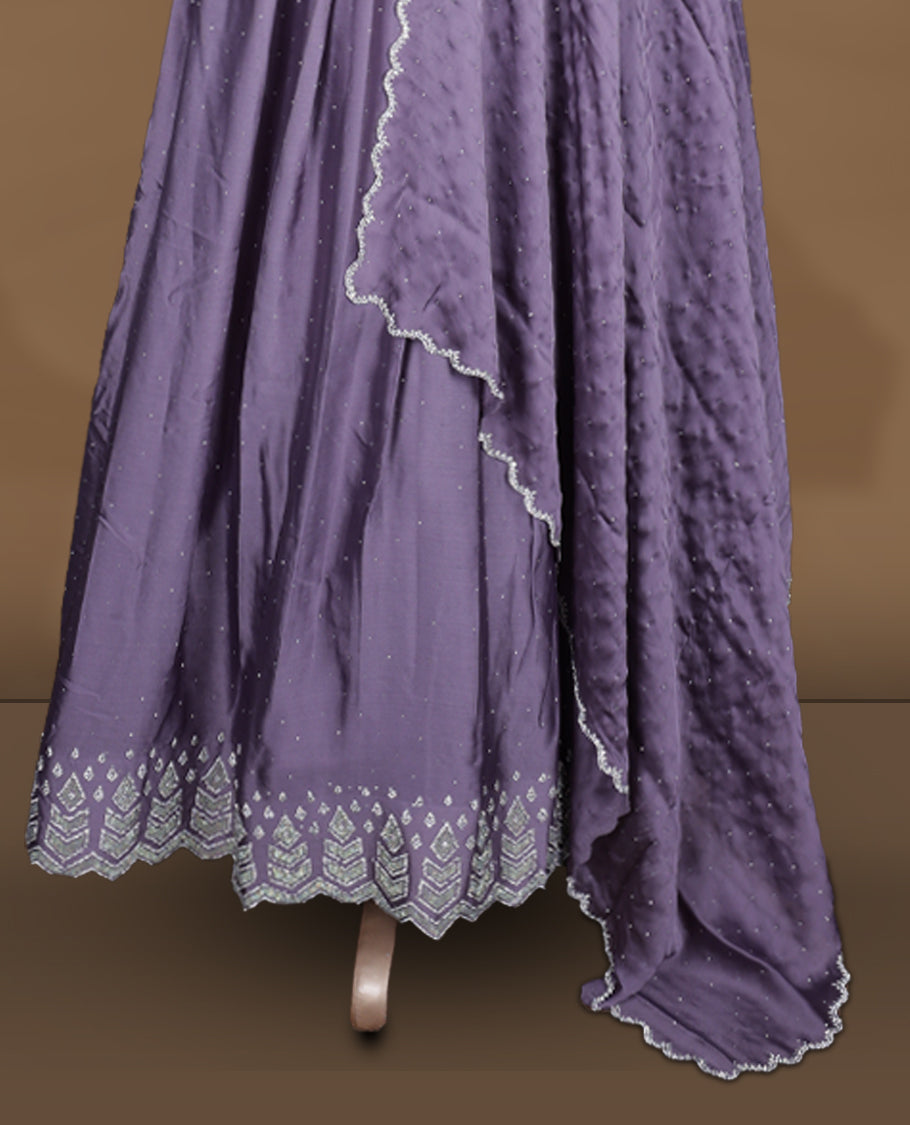 Dusty purple colour stitched gown set with sleeveless embroidered yoke, flared ankle‑length silhouette, and attached dupatta edged with scalloped beadwork and matching embroidered hem.