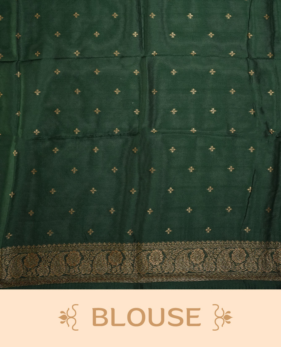 Dark green colour semi Banarasi Tussar Georgette saree with gold zari motifs on the body, a grand woven golden pallu, and ornate zari border. Includes a matching blouse piece for a complete look.