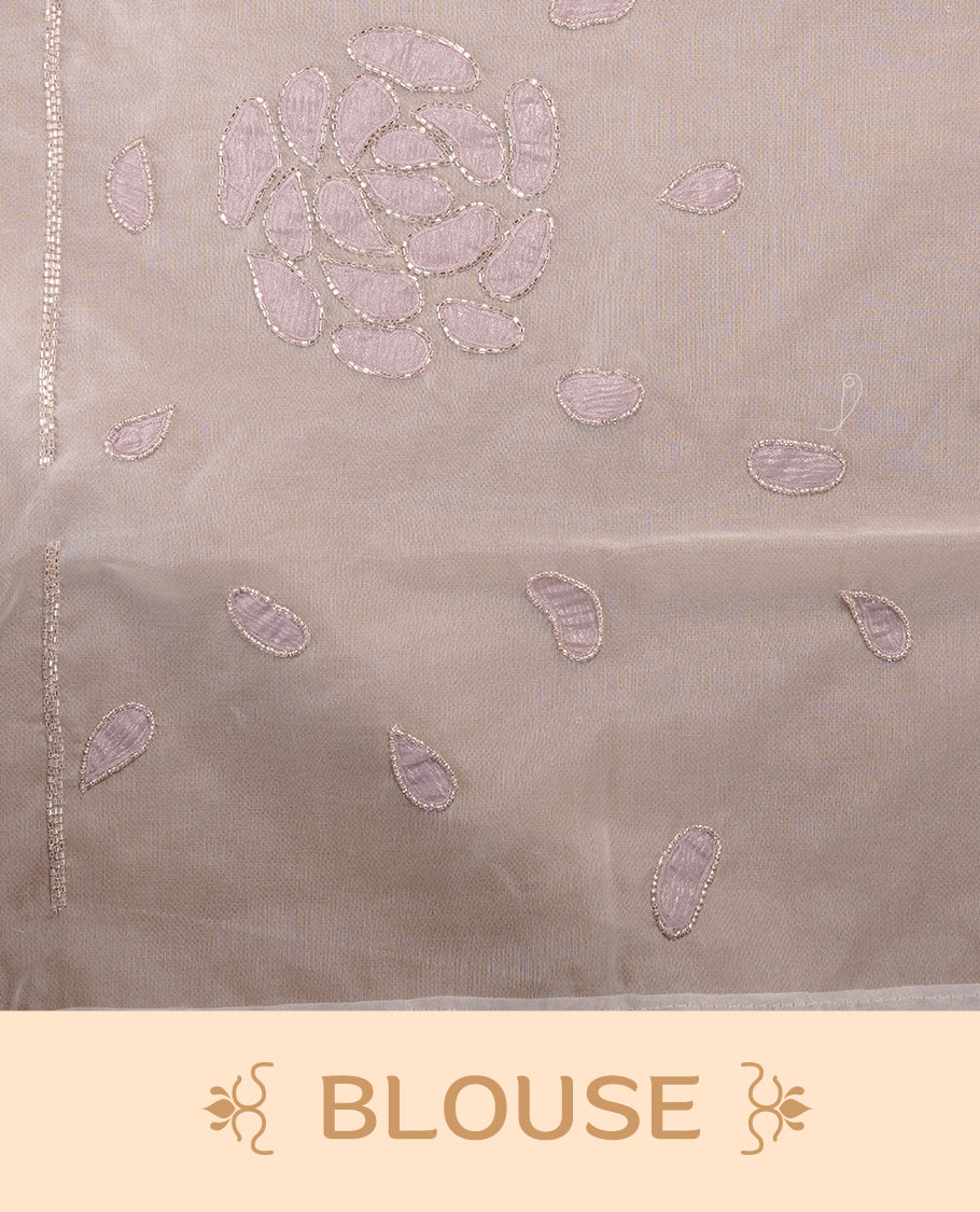 White colour net orange saree featuring pastel purple floral pattern with cut beats on body, highlighting scalp border, paired with matching blouse piece.