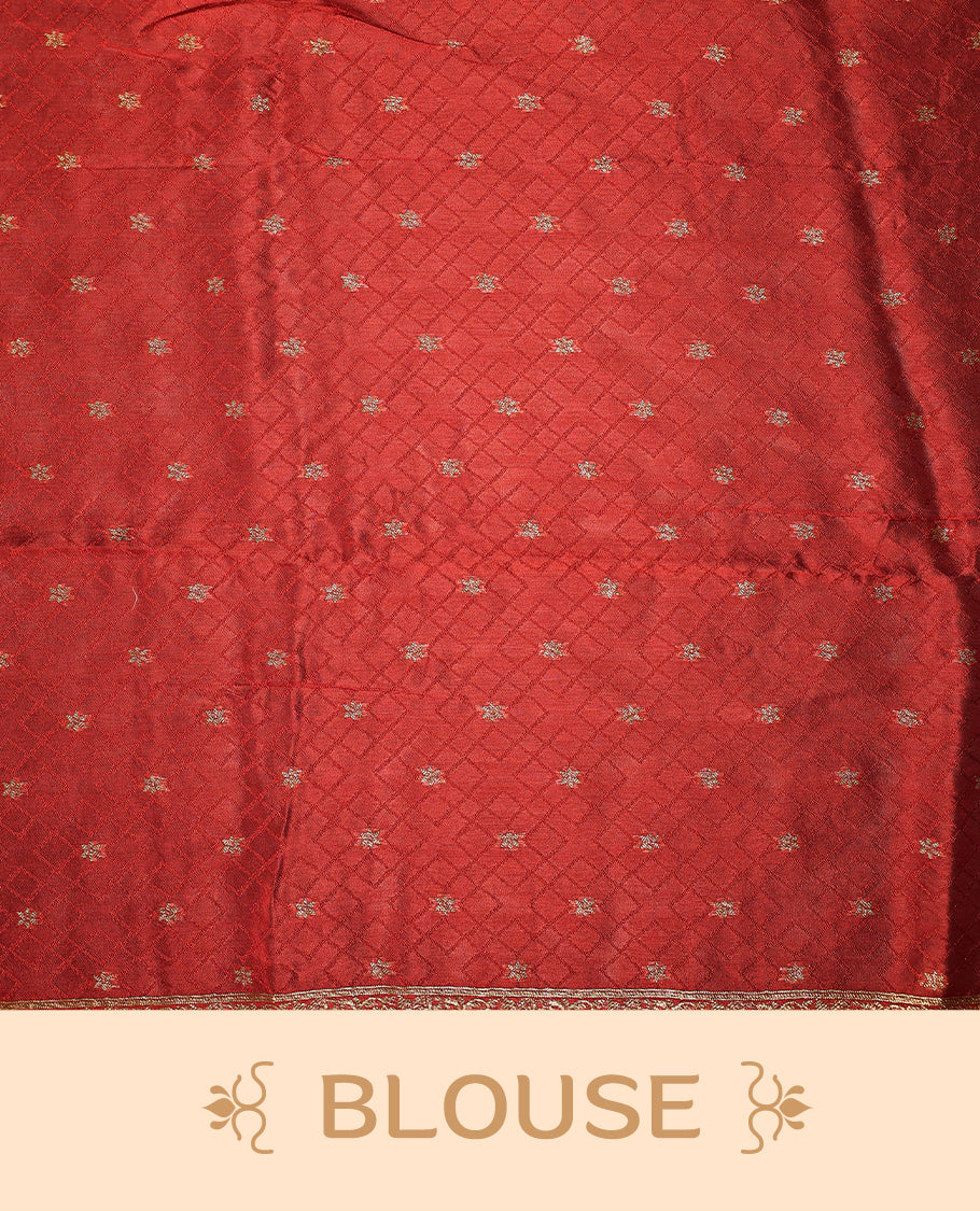 Cherry red semi Banaras tussar saree adorned with golden floral motifs in diagonal patterns across the body and a finely woven zari border, finished with a rich golden pallu, paired with a matching blouse.