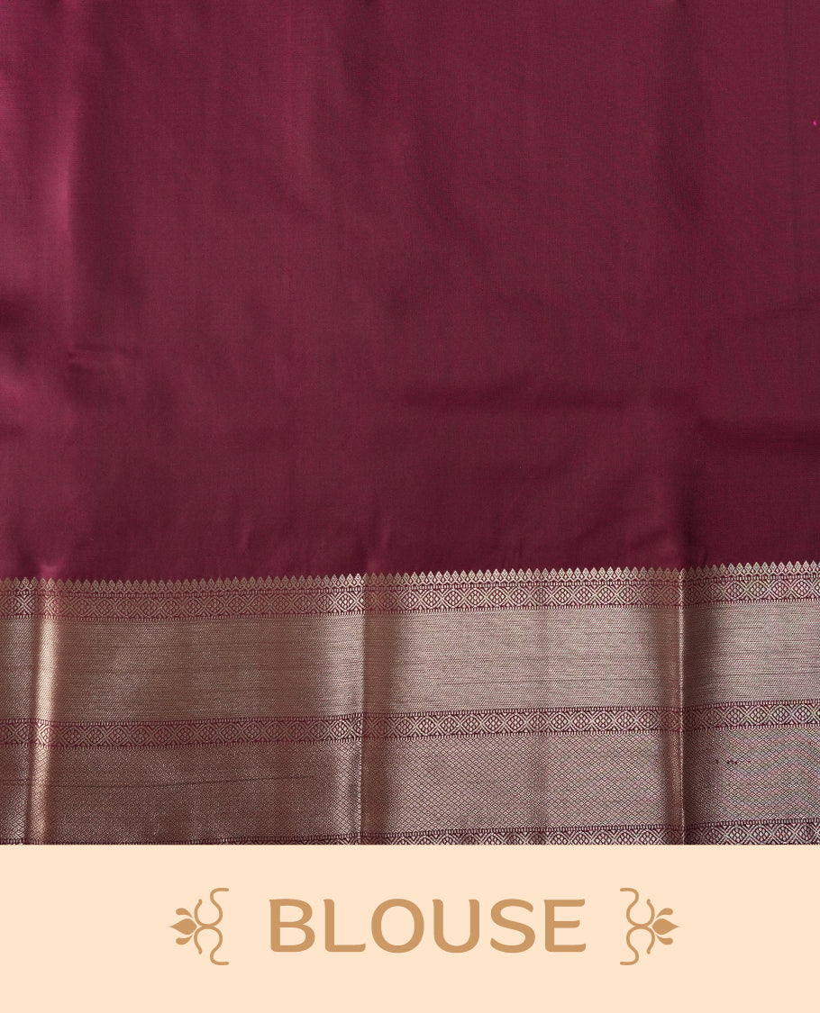 Wine colour soft silk saree beautifully adorned with silver zari buttas, paired with a rich silver zari border and pallu & Completed with a matching blouse.