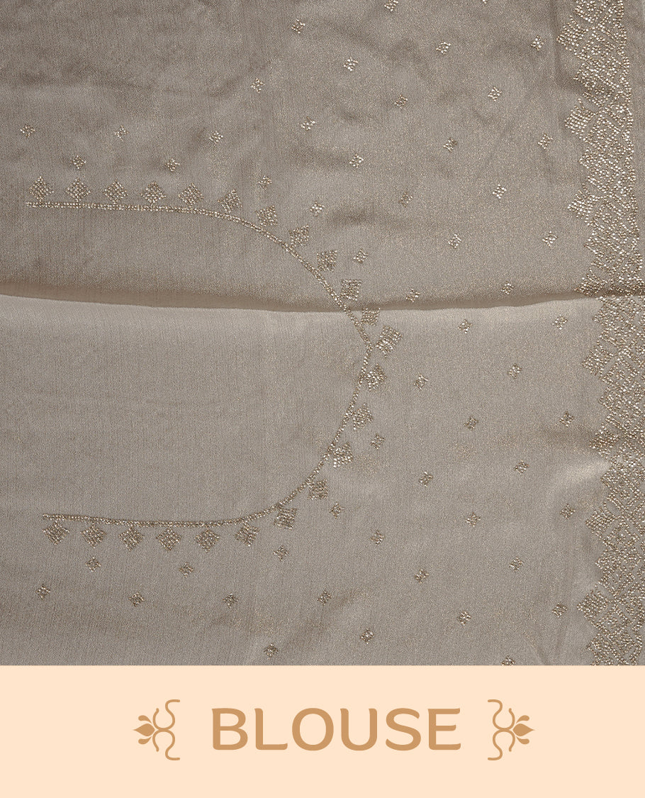 Off white colour organza designer saree featuring Gold stone motifs on body, highlighting light weight stone worked border, paired with matching blouse piece.