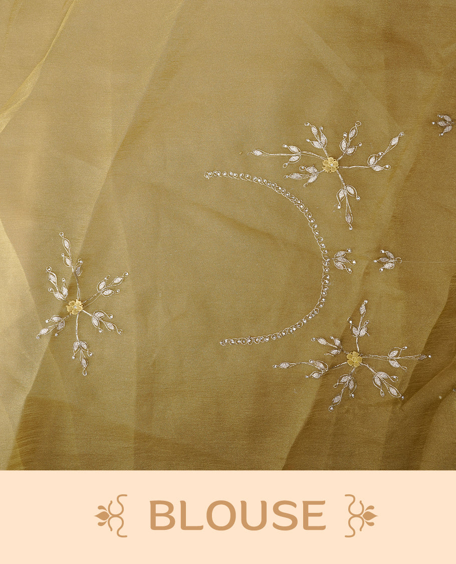 Pastel olive colour crush organza saree featuring gold thread floral and stone worked body, highlighting scalp designed border, paired with matching blouse piece.
