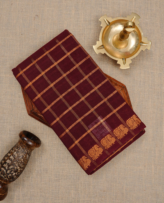 Maroon colour Sungudi cotton saree featuring Gold zari Check pattern on body, Gold zari Peacock design on Self colour border, paired with matching blouse piece.