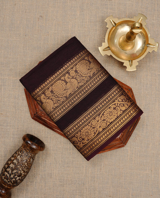 Chocolate Brown colour Chettinad cotton saree featuring Elegant plain body , complemented by self colour with zari border, comes with matching blouse piece.