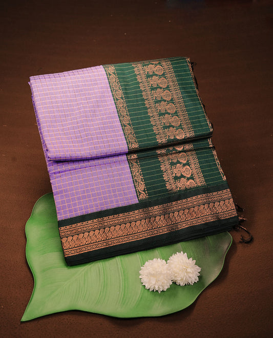 Lavender colour kalyani cotton saree featuring gold zari check pattern on body, complemented by green colour with Antique zari border, paired with matching blouse piece.