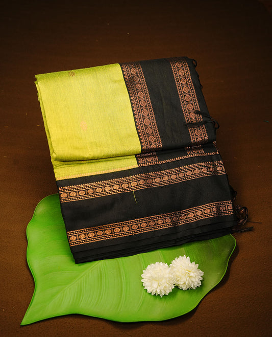 Lemon colour kalyani cotton saree featuring Elegant plain body, complemented by black colour with Antique zari border, paired with matching blouse piece.