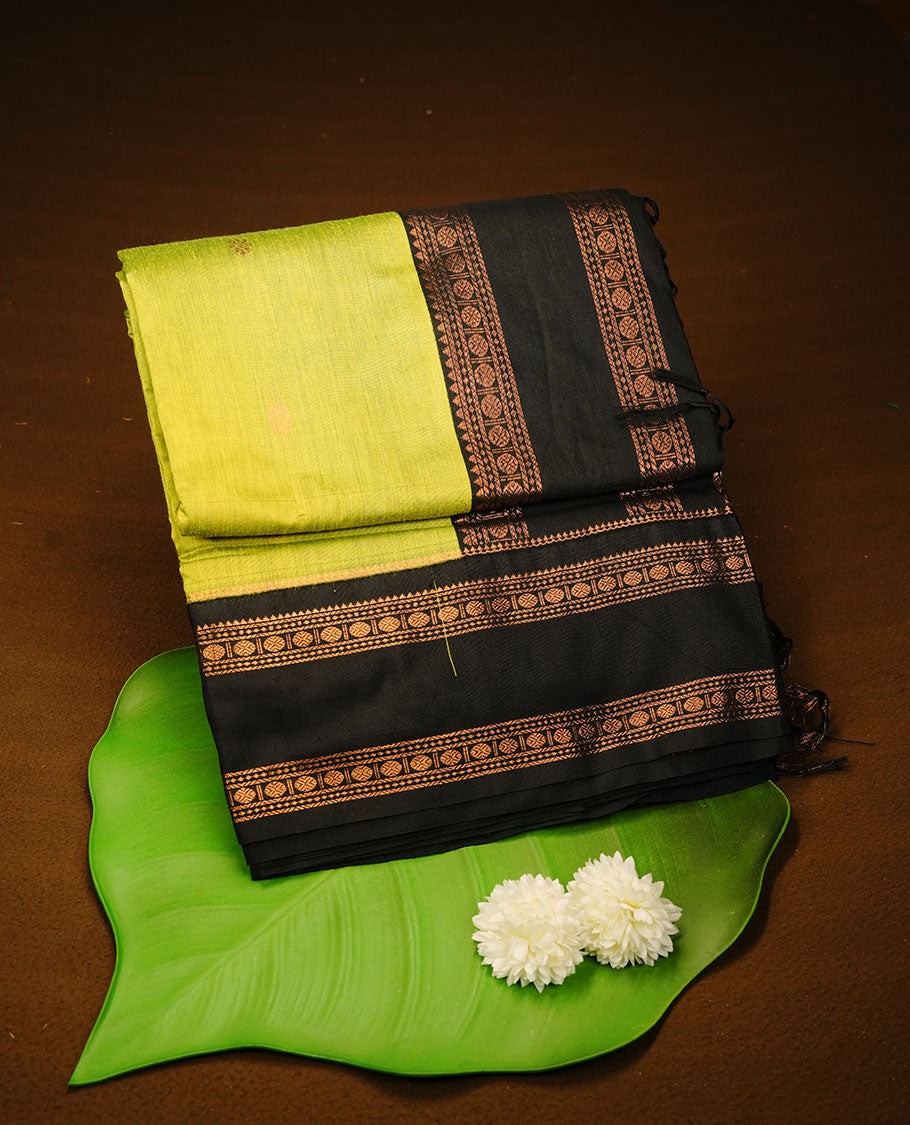 Lemon colour kalyani cotton saree featuring Elegant plain body, complemented by black colour with Antique zari border, paired with matching blouse piece.