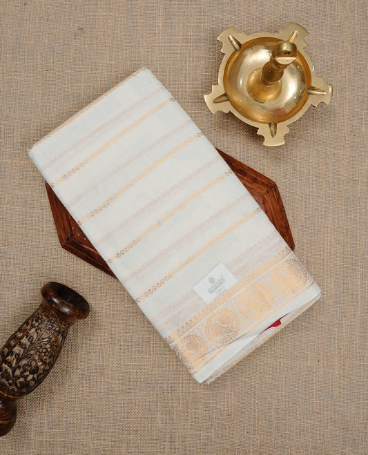 Off white colour Sungudi cotton saree featuring Gold zari Zigzag stripes on body, Gold zari Peacock chakram design on Self colour border, paired with matching blouse piece.