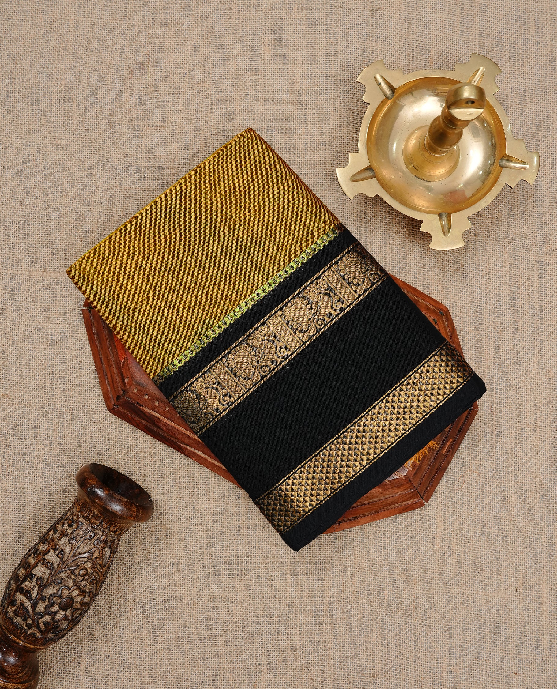Mustard Colour Chettinad cotton saree featuring elegant plain body , complemented by contrast Black colour with traditional border, comes with matching blouse piece.