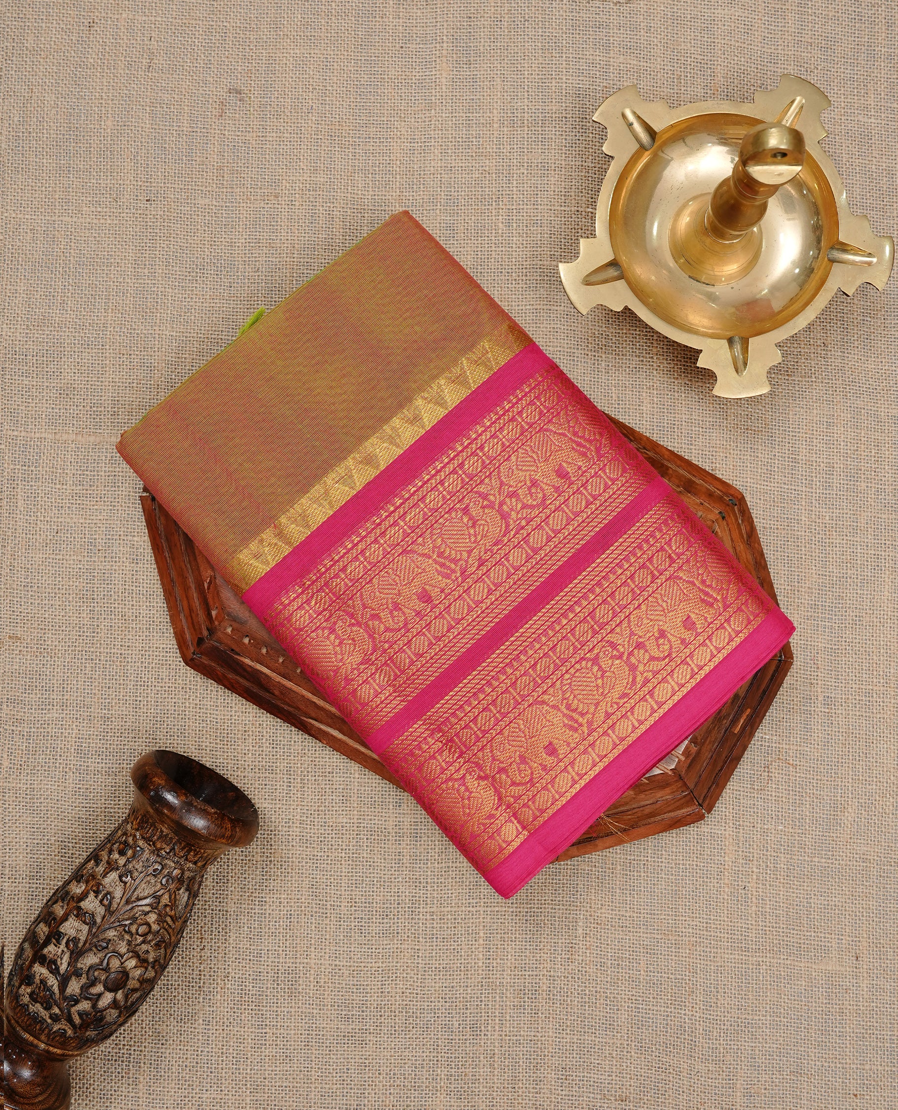 Olive colour Chettinad cotton saree featuring Elegant plain body, complemented by contrast Maroon colour with gold zari border, paired with matching blouse piece.