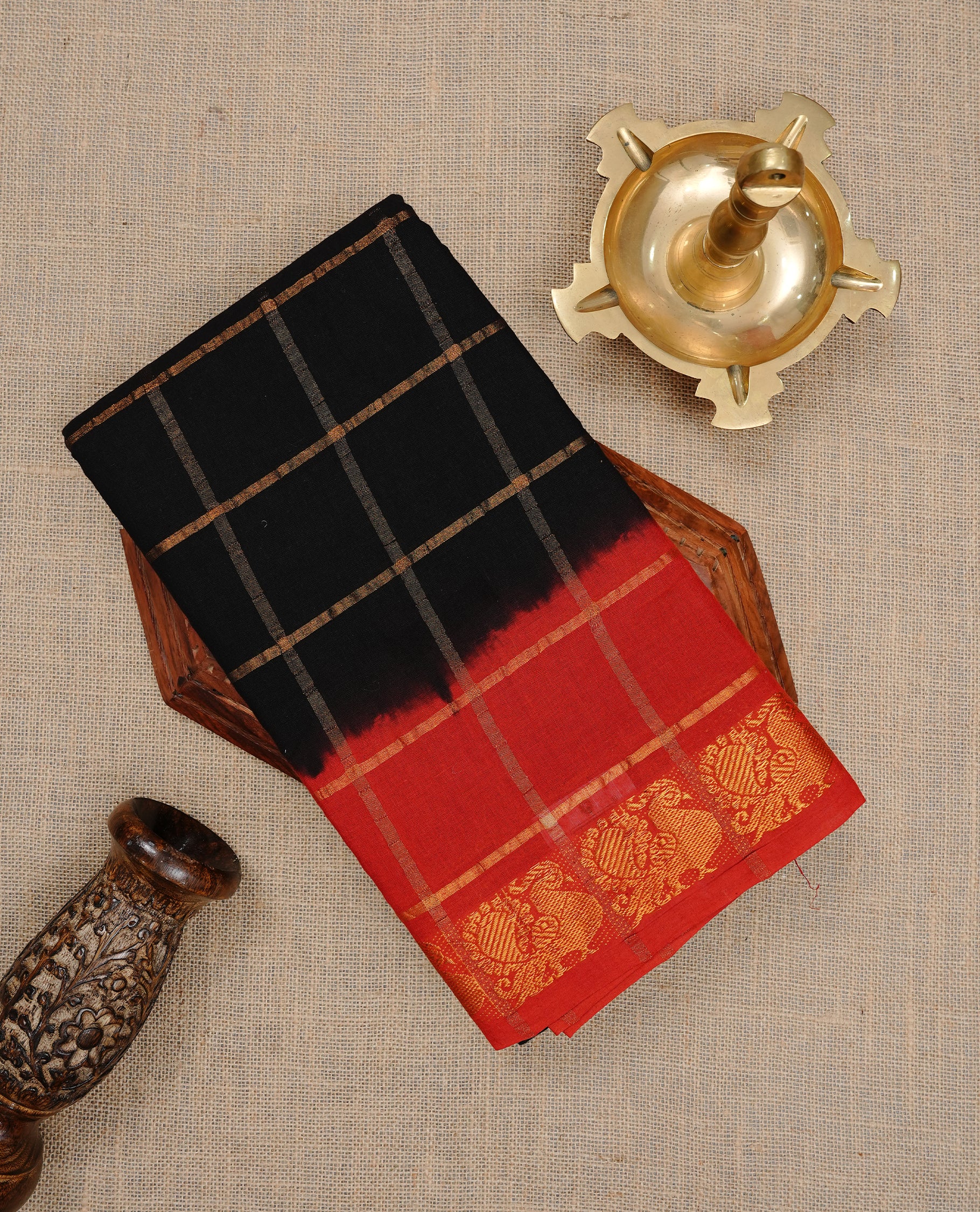 Black colour Sungudi cotton saree featuring Gold zari Check pattern on body, Gold zari Peacock design on Dyed Red colour design border, paired with matching blouse piece.