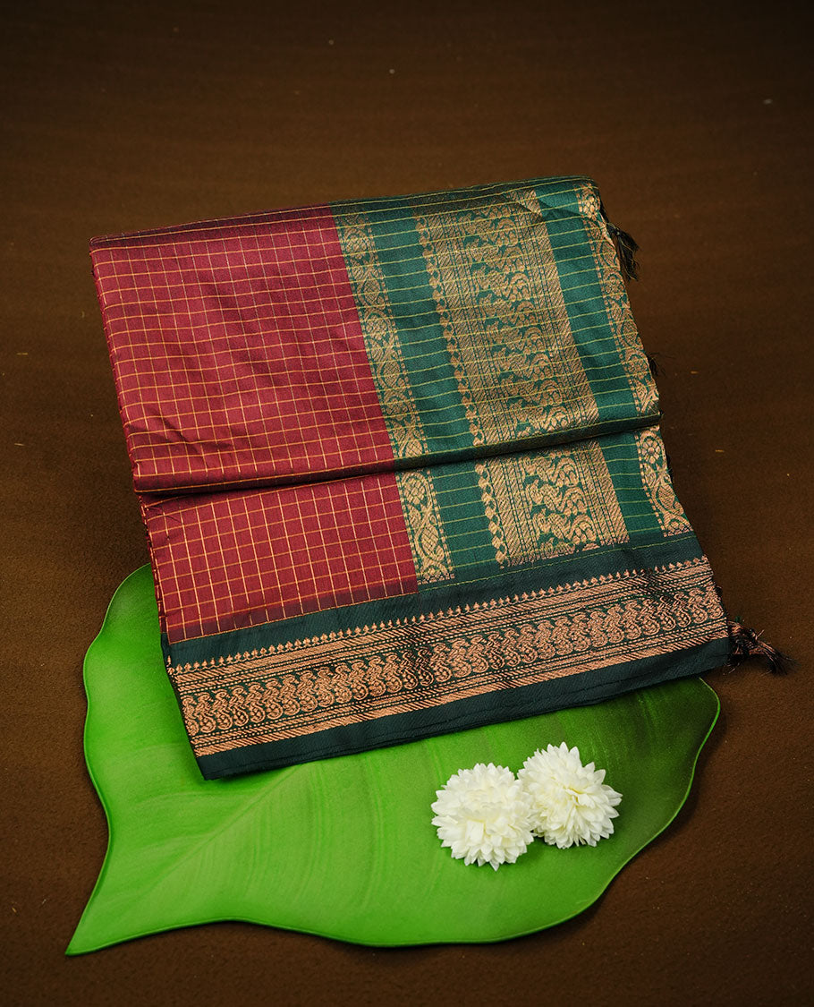 Maroon colour kalyani cotton saree featuring gold zari check pattern on body, complemented by green colour with Antique zari border, paired with matching blouse piece.
