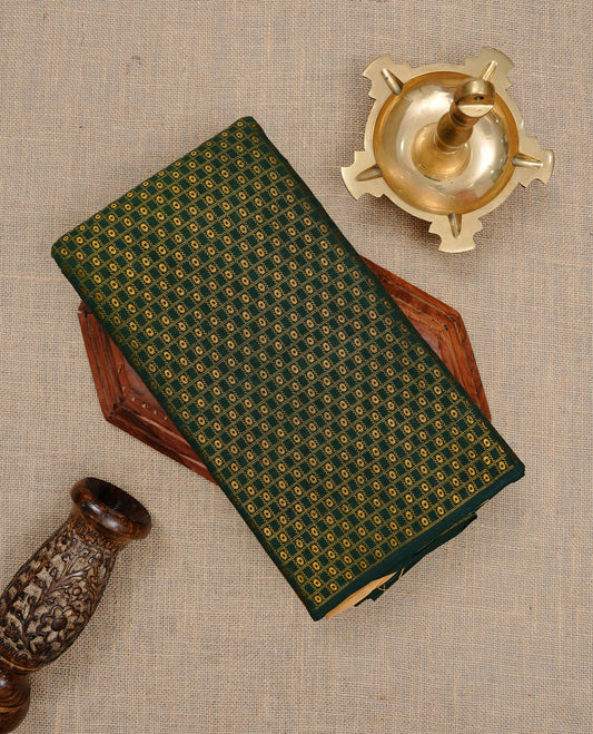 Green colour Sungudi cotton saree featuring Gold zari Stripes on body, Gold Small check zari on Self colour border, paired with matching blouse piece.