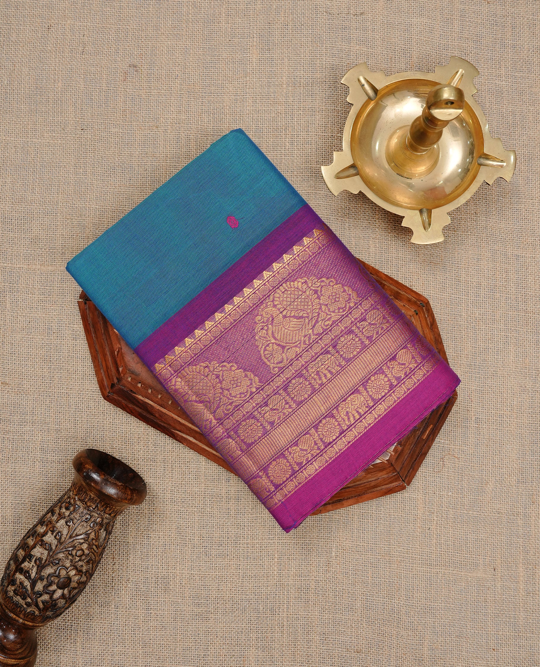 Teal colour Chettinad cotton saree featuring motifs on body , complemented by contrast Magenta colour with zari border, comes with matching blouse piece.