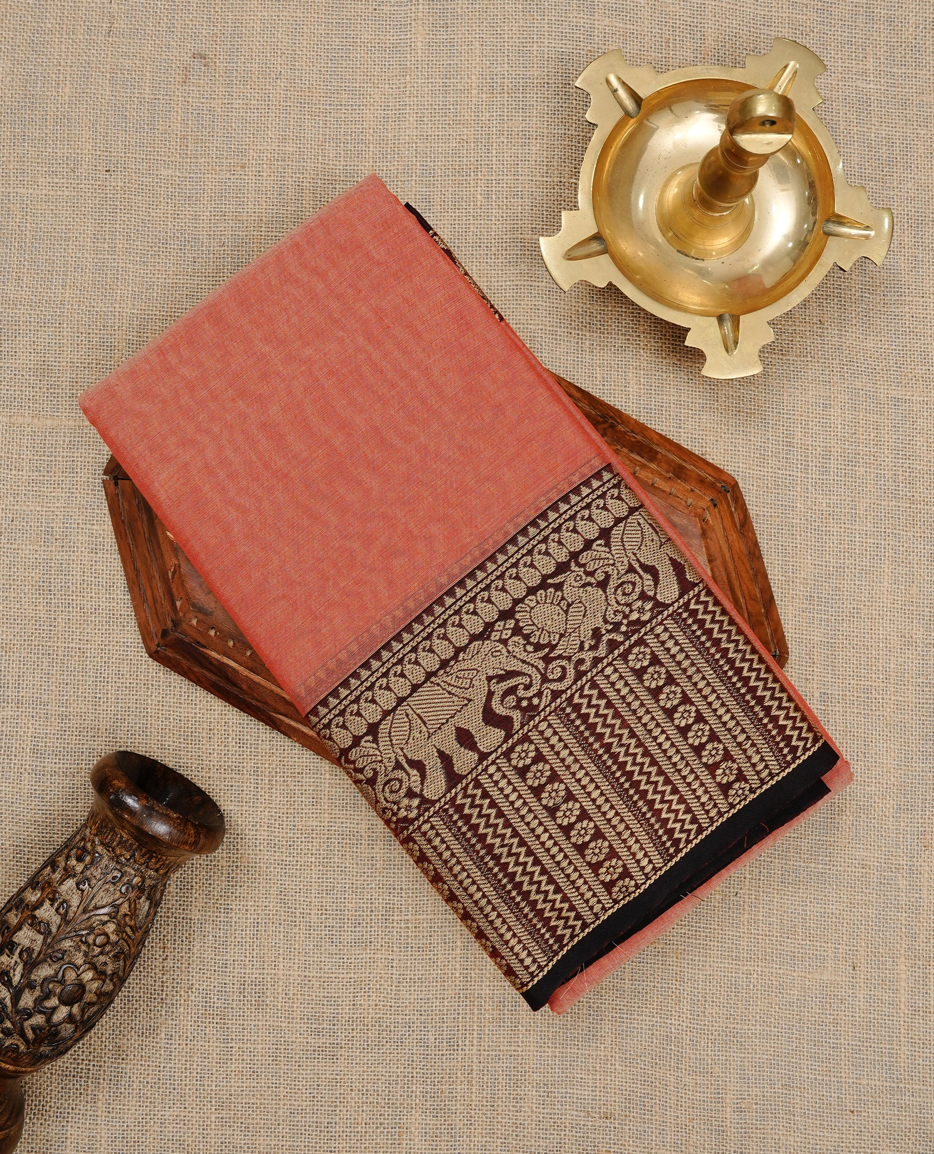 Peach colour Narayanapett cotton saree Featuring Elegant plain Body, complemented by Contrast Maroon colour with cream zari border, paired with matching blouse piece.