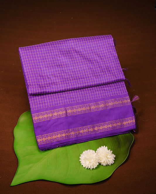 Indigo colour kalyani cotton saree featuring check pattern on body, complemented by self colour with traditional border, paired with matching blouse piece.