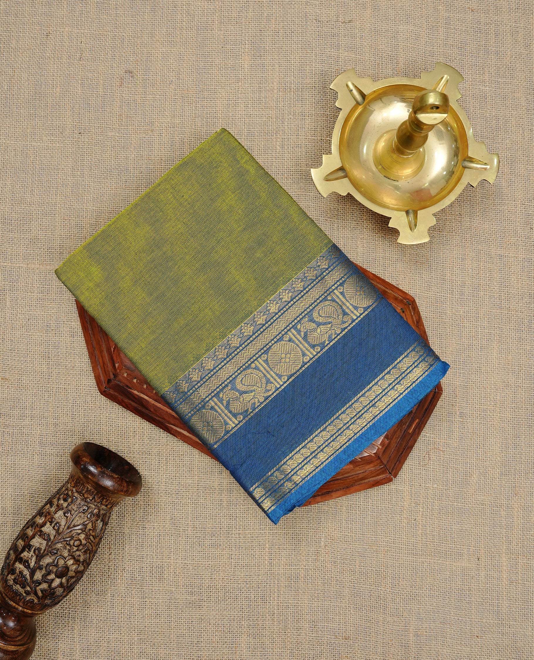 Lemon Green colour Chettinad cotton saree featuring Elegant plain body, complemented by contrast Blue colour with gold zari border, paired with matching blouse piece.