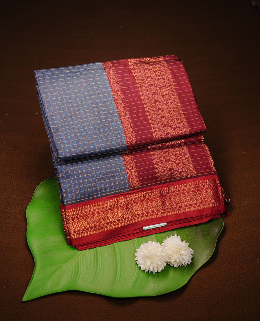 Teal colour kalyani cotton saree featuring antique zari motifs on body, complemented by Maroon colour with Antique zari border, paired with matching blouse piece. (Copy)