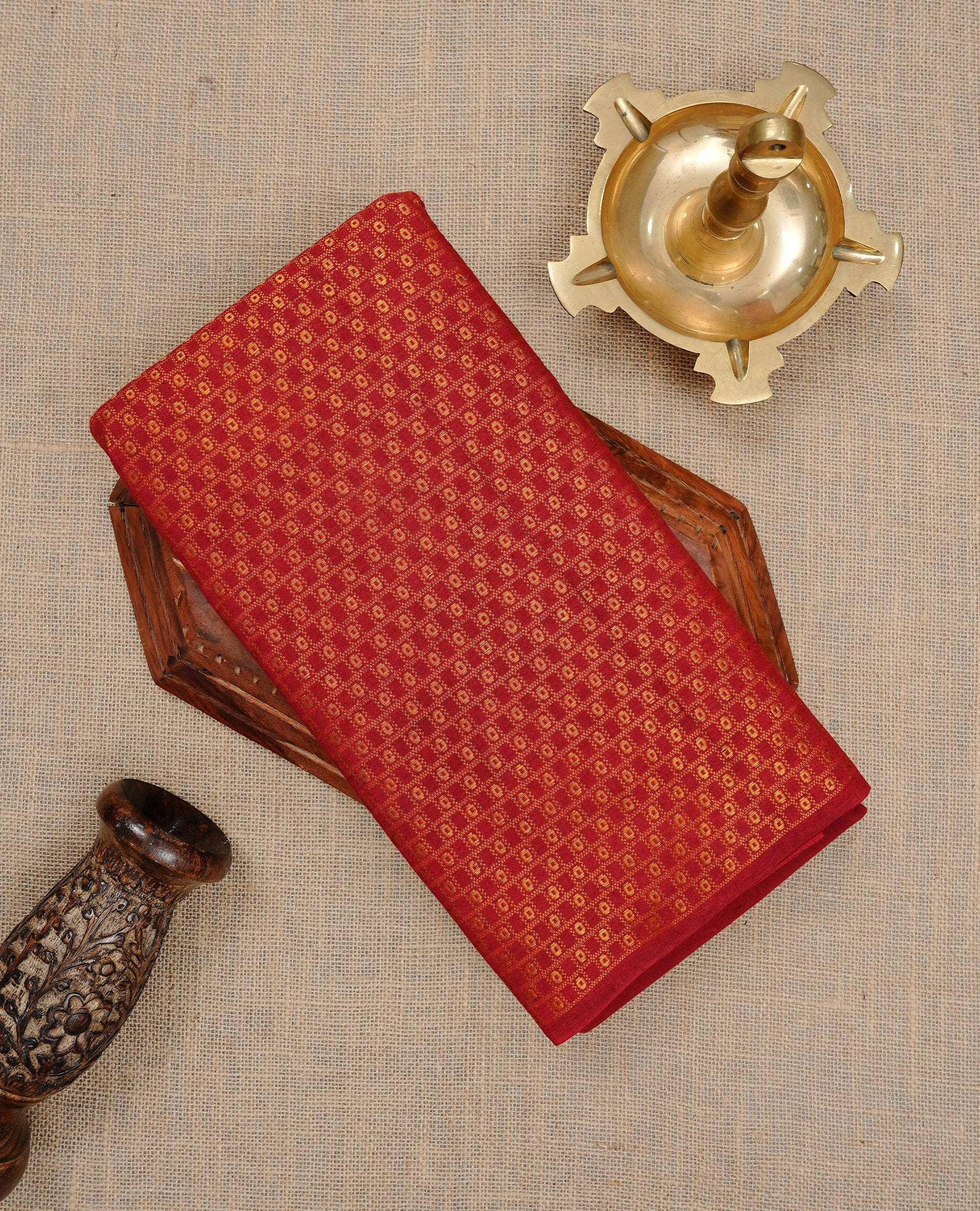 Maroon colour Sungudi cotton saree featuring Gold zari Stripes on body, Gold Small check zari on Self colour border, paired with matching blouse piece.