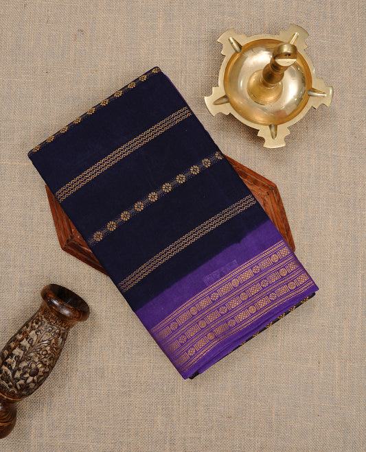 Navy Blue colour Sungudi cotton saree featuring Gold zari Stripes on body, Gold zari on Contrast Purple colour border, paired with matching blouse piece.