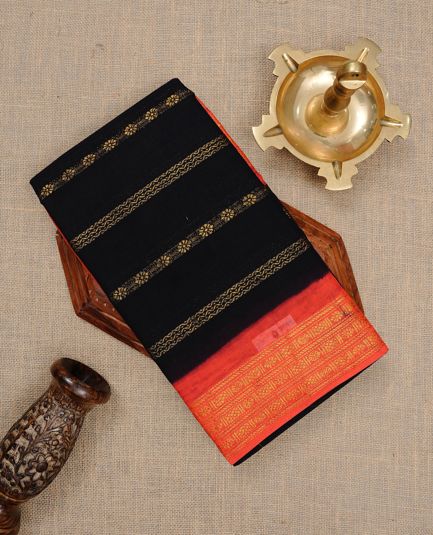 Black colour Sungudi cotton saree featuring Gold zari Stripes on body, Gold zari on Contrast red colour border, paired with matching blouse piece.