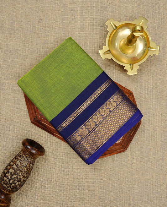 Lemon green Colour Chettinad cotton saree featuring elegant plain body , complemented by contrast Navy blue colour with traditional border, comes with matching blouse piece.