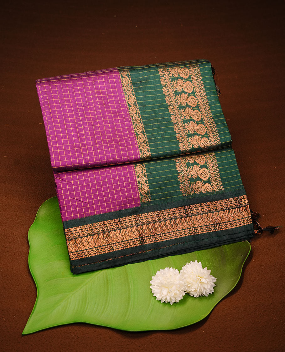 Purple colour kalyani cotton saree featuring gold zari check pattern on body, complemented by green colour with Antique zari border, paired with matching blouse piece.