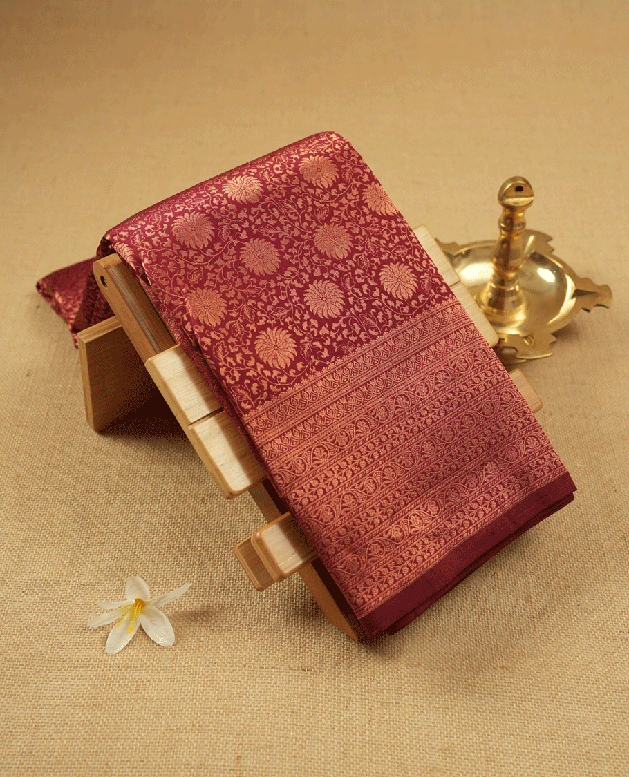 Dark Maroon Kancheepuram Silk Brocade Saree having Floral Jaal Worked Body with Self Coloured Brocade Border and Blouse