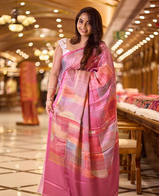 Pink colour abstract digital print saree featuring a unique border and printed pallu, paired with a matching blouse