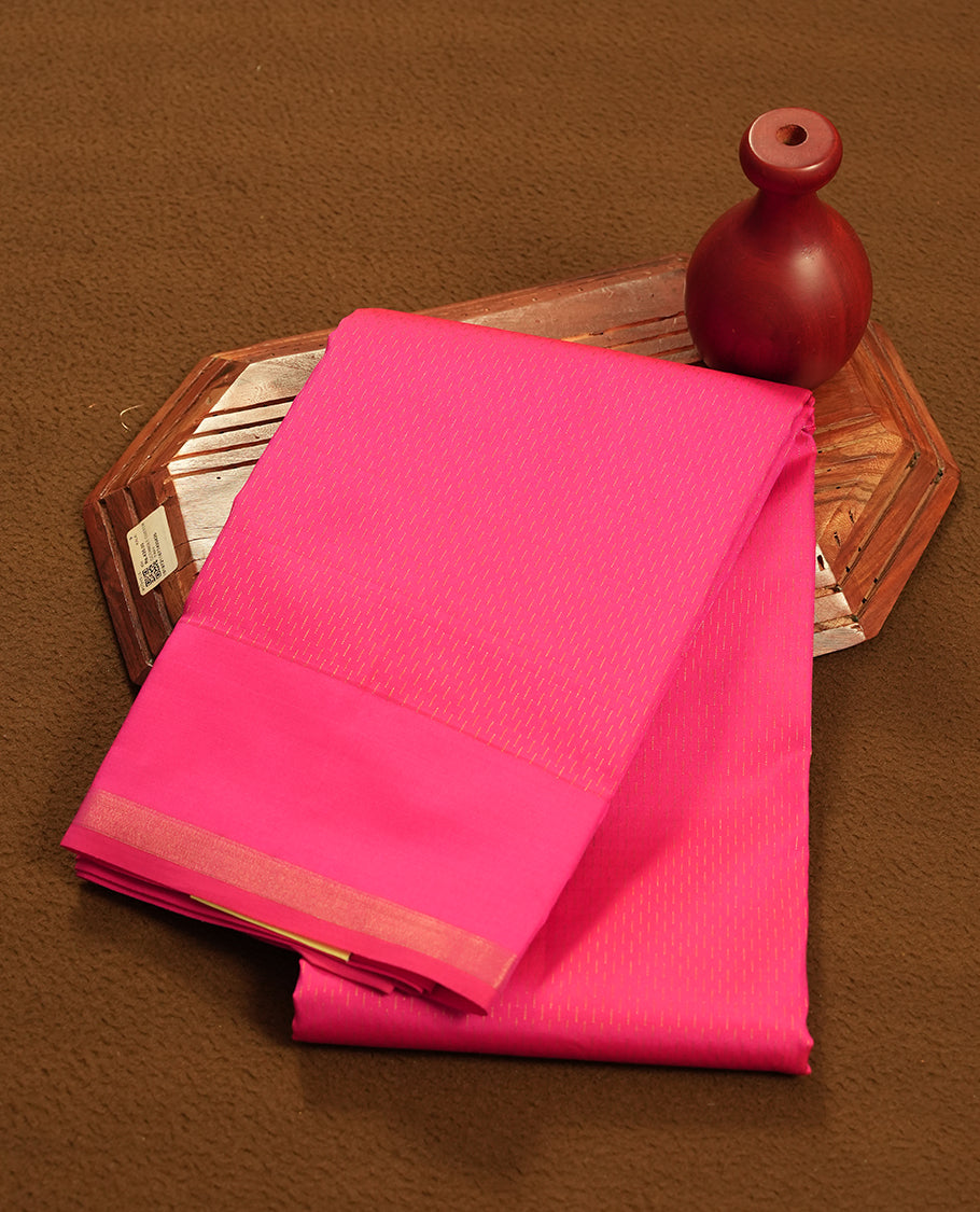 Rouge pink colour semi soft silk saree featuring a golden textured patterned body, complemented by self coloured pallu & border and a matching blouse piece.
