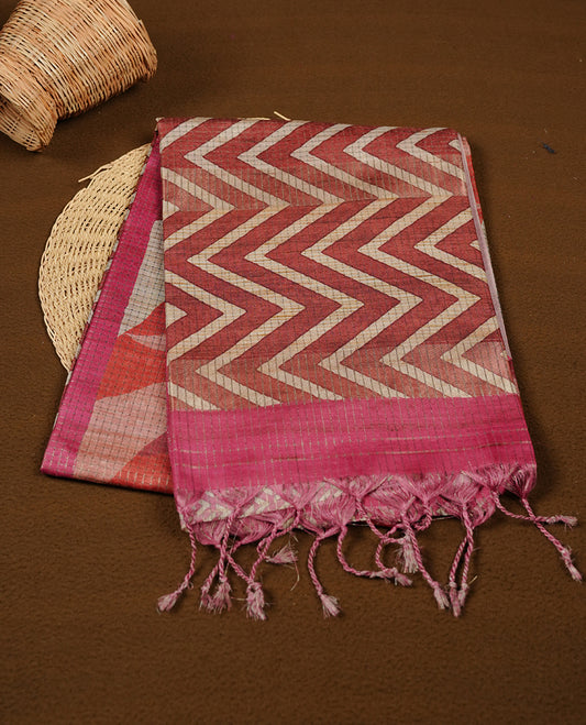 Pink colour semi tussar silk saree featuring zigzag print and zari check pattern across body, self colour border with geometric pattern and pallu, paired with matching blouse piece.