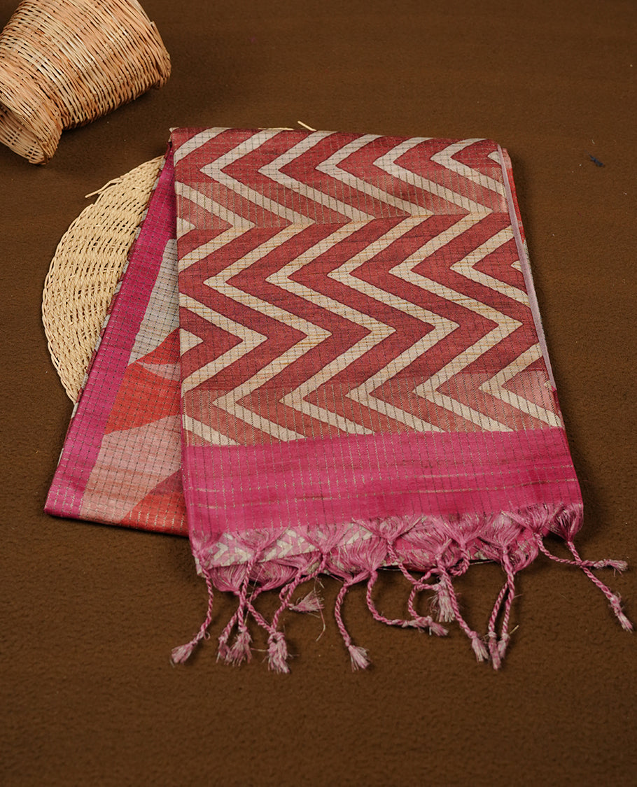 Pink colour semi tussar silk saree featuring zigzag print and zari check pattern across body, self colour border with geometric pattern and pallu, paired with matching blouse piece.