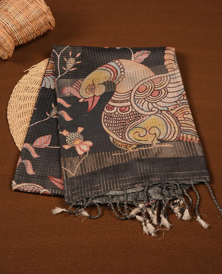 Black colour semi tussar silk saree featuring floral and animal print, zari check pattern across body, self colour border and pallu, paired with matching blouse piece.