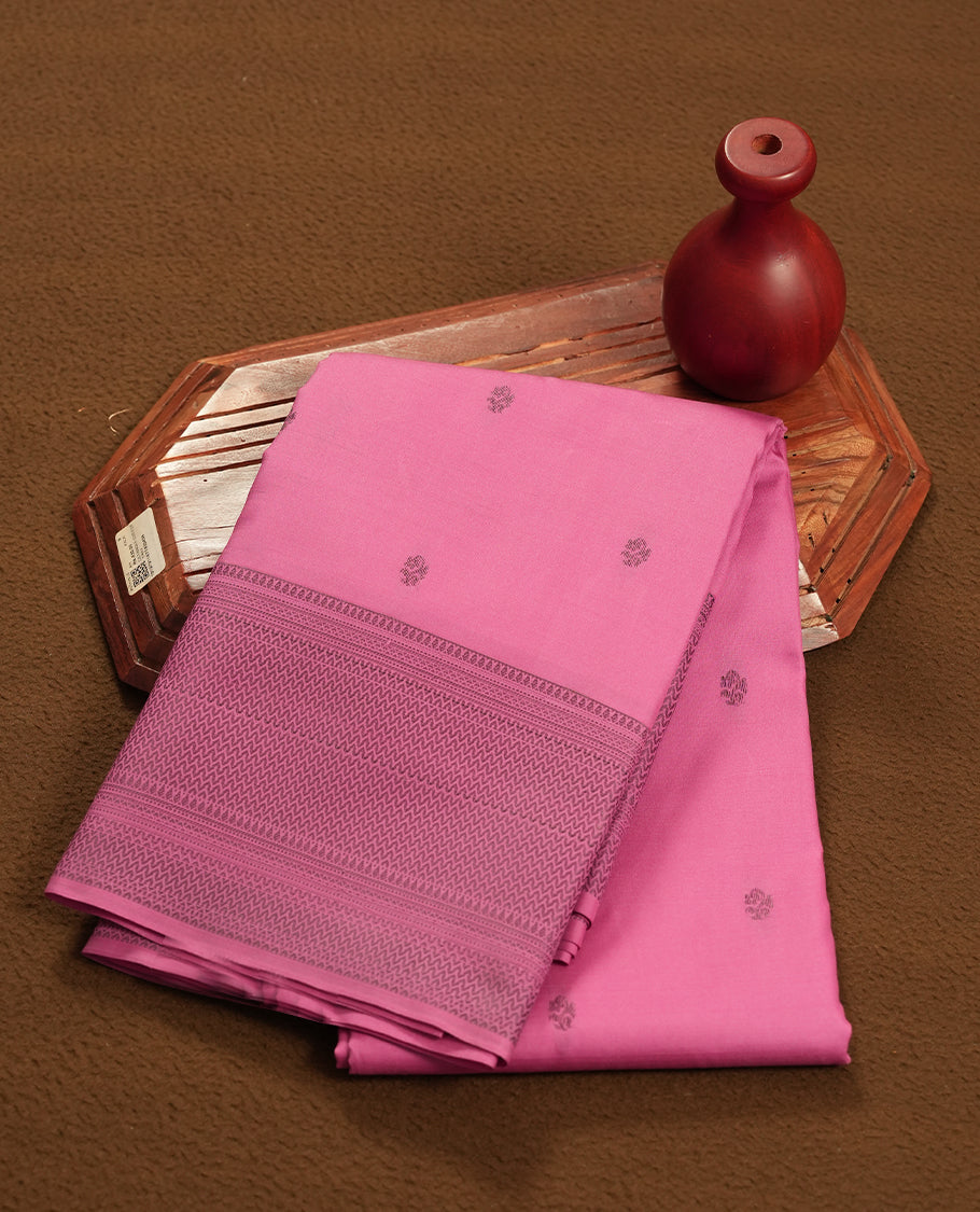 Mulberry colour semi soft silk saree featuring a gray textured patterned body, complemented by self coloured gray colour motifes on pallu & border and a matching blouse piece.