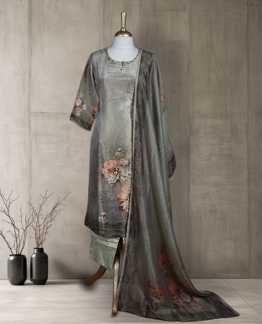 Antique gold colour salwar from TWARA, featuring a delicate embroidered neck with floral thread work & sequin highlights, all over golden and beige style floral on the top, paired with a matching bottom and an elegant dupatta.