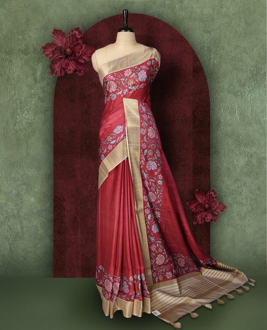 Maroon colour Semi Tussar Silk saree with vibrant digital floral printed body and elegant Kandha work border & Paired with a matching blouse, it beautifully blends traditional craftsmanship with modern charm.