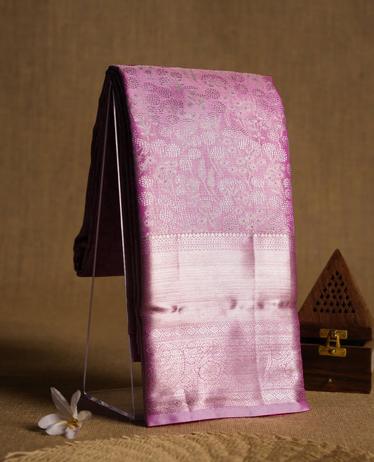 Taffy pink colour and silver Zari Tissue Brocade Saree features intricate floral Motifs on body and self coloured with gold traditional border & pallu, paired with matching blouse