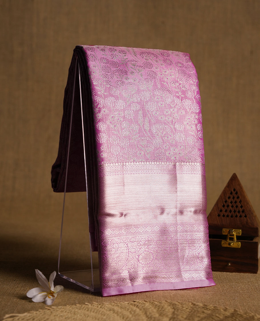 Taffy pink colour and silver Zari Tissue Brocade Saree features intricate floral Motifs on body and self coloured with gold traditional border & pallu, paired with matching blouse