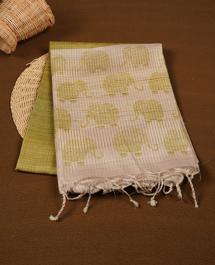 Green colour semi tussar silk saree featuring Antique zari check pattern across body, contrast Cream colour border with elephant print and pallu, paired with matching blouse piece.