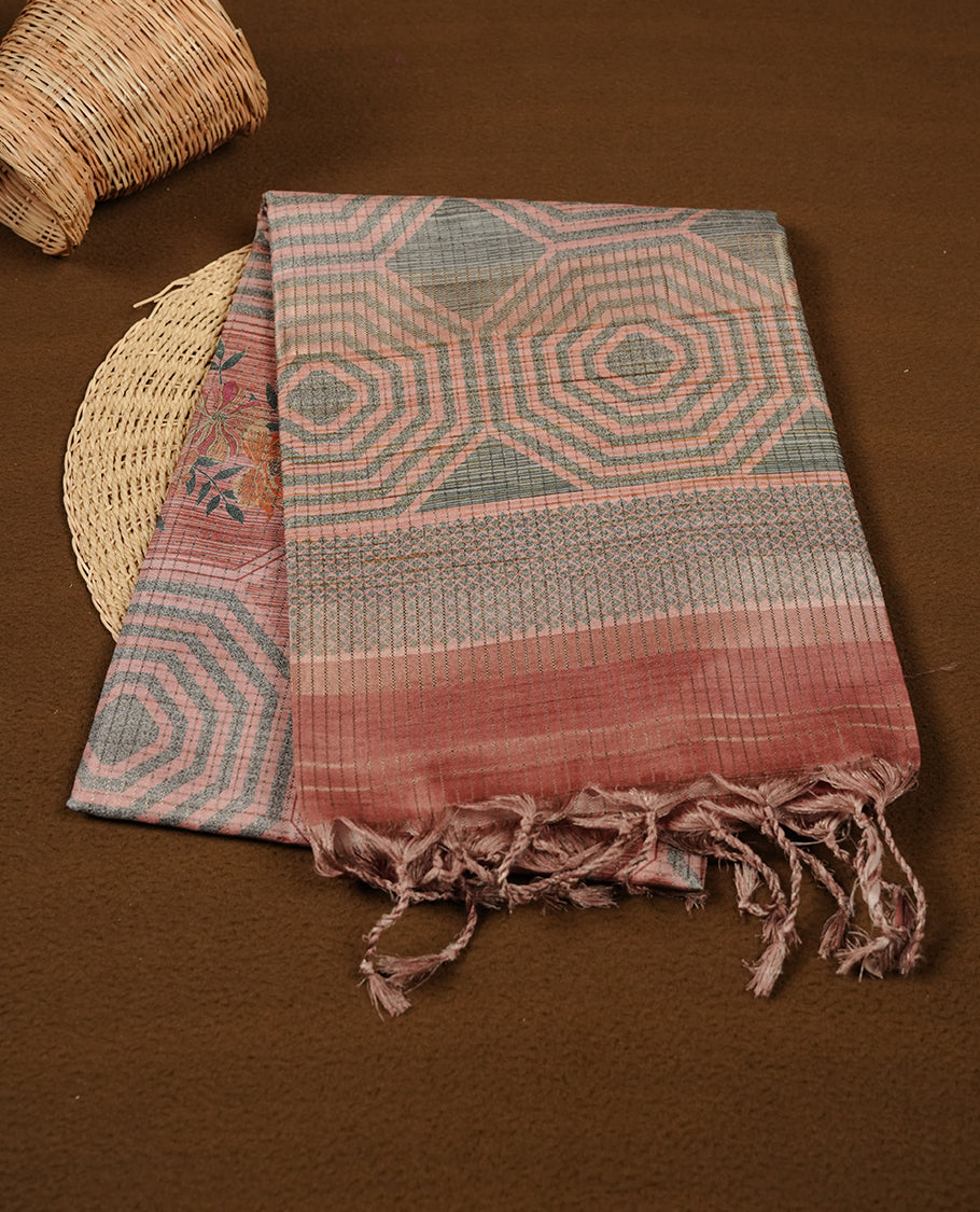 Muted brown colour semi tussar silk saree featuring grey geometric print and zari check pattern across body, self colour border and pallu, paired with matching blouse piece.
