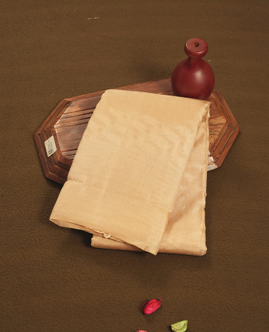 Wheat colour semi soft silk saree featuring a self coloured textured patterned body, complemented by self coloured pattern on pallu & border and a matching blouse piece.