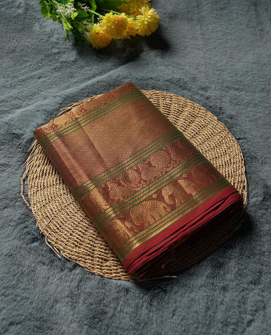 Olive Yellow Colour silk cotton saree with rich temple-red zari border featuring peacocks and elephant motifs, subtle gold-striped pallu, and a coordinated Olive Yellow blouse with matching zari border.