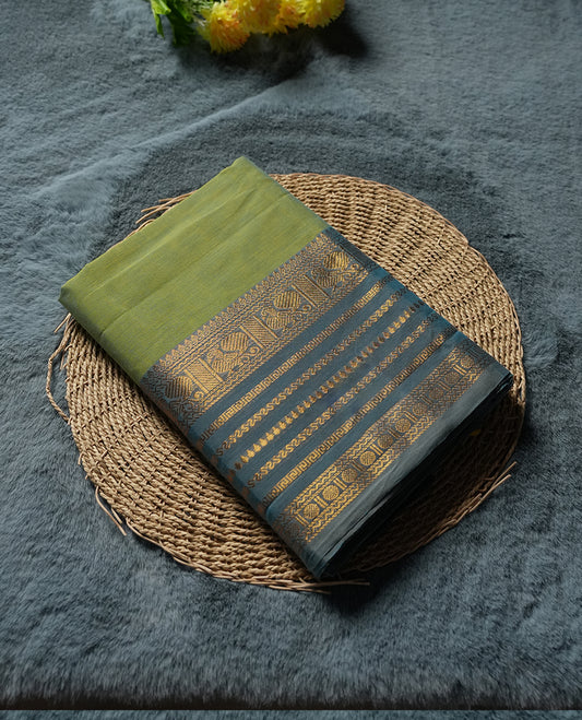 Lime Green colour Silk Cotton Saree with Dual-Tone Teal Zari Border Featuring Peacock Panels and Geometric Stripes, Clean Body, Striped Zari Pallu, and a Coordinated Matching Blouse Piece