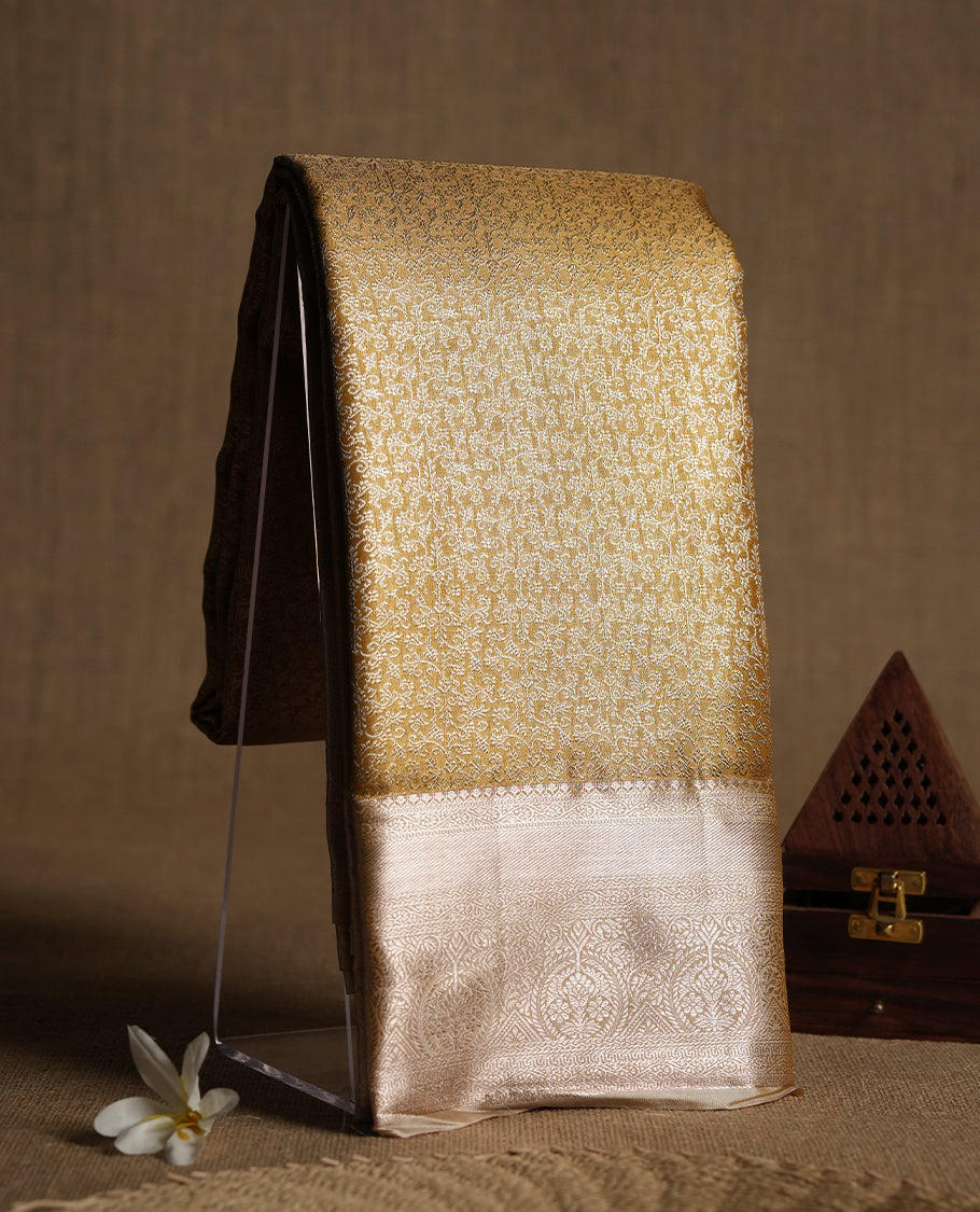 Golden colour and silver Zari Tissue Brocade Saree features intricate Motifs on body and rose gold colour traditional border & pallu, paired with matching blouse