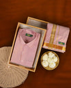 Elegant pastel pink shirt & dhoti set by HMG, adorned with rich gold zari borders & Perfect for weddings, festive occasions & gifting.