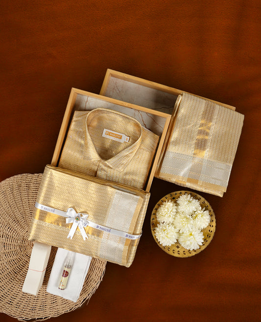 Elegant Gold  shirt & dhoti set by PASUTHI with rich zari weave and elegant shin, Ideal for weddings, functions & festive gifting & Includes towel, vibhuti & attar in a premium gift box.