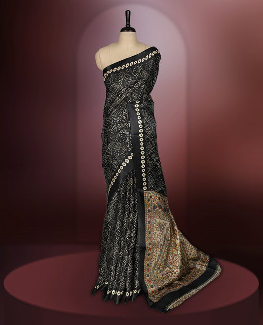 Black colour saree with intricate cream dotted patterns and a striking Madhubani inspired pallu, The soft fabric offers a graceful drape, making it perfect for festive and formal occasions, paired with blouse.