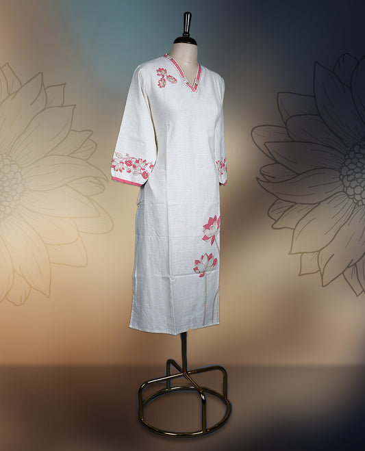 Off white colour kurthi with delicate pinkish peach floral embroidery on the neckline, sleeves, and hem, Featuring a stylish V neck and three quarter sleeves, perfect for a graceful and comfortable look.