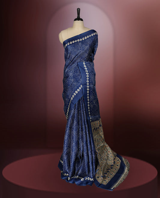 Navy blue colour saree with intricate cream dotted patterns and a striking Madhubani inspired pallu, The soft fabric offers a graceful drape, making it perfect for festive and formal occasions, paired with blouse.